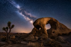 Joshua Tree National Park Calif. 4 Arch Rock beneath the Milky Way in Joshua Tree National Park, California, showcasing spectacular desert stargazing and dramatic granite rock formations.