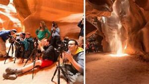Discover Antelope Canyon: A Breathtaking Arizona Vacation Spot 3 People tsaking photos with cameras in narrow passageways at a canyon.