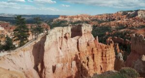 Large canyon walls with vegetation on a partly cloudy day