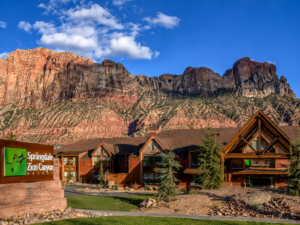 Zion National Park Utah Vacation 6 Scenic lodge in Springdale, Utah, surrounded by towering red and white sandstone cliffs near Zion National Park.