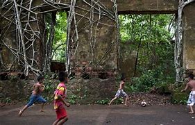 kids playing near ancient ruins at Amazon rainforest