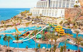 hotel at the ocean with a pool