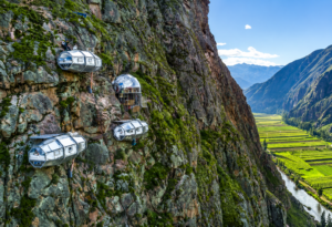 Skylodge glass pods attached to a steep mountain cliff overlooking the Sacred Valley near Cusco, Peru