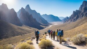 Big Bend, Texas: Ultimate Outdoor Adventure in the National Park 6 Several hikers with backpacks walking along a trail through a scenic valley.