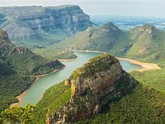 Tugela Falls, South Africa Tour 3 Canyon with steep walls in a rainforest with a river on a cloudy day.