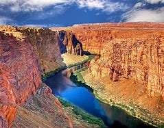 canyon with steep walls with a river flowing through the center