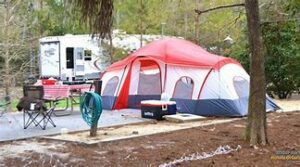 campsite with ten and Rv in the woods
