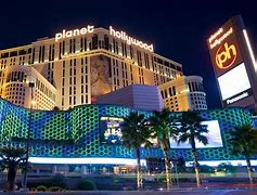 Explore the Best West Canyon Adventures: Top 15 Camping & Hiking Destinations ?⛺ 12 Buildings at night with palm trees and lighted buildings.