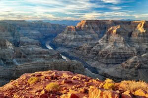?️ 5 Stunning Canyon Campsites You’ve Probably Never Heard of 2 steep canyon walls with a river flowing through the canyon looking out from a ledge