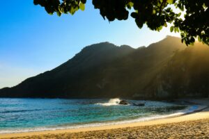 Beach with the ocean and a mountain