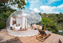 Isla Grande, Rosario Islands, Colombia: Tropical Beachfront Glamping Escape✨ 2 Glamping see through bubble with chairs and a bed with trees and a deck in the rainforest