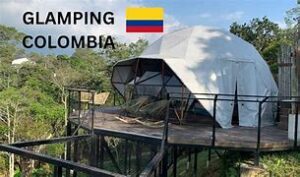 Isla Grande, Rosario Islands, Colombia: Tropical Beachfront Glamping Escape✨ 3 Glamping structure in the rainforest on stilts with chairs.