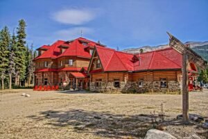 Lodge on a small hill with a blue sky.