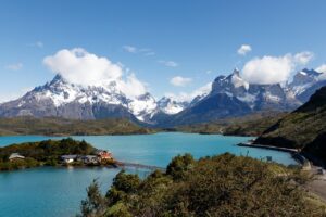 Torres Del Paine, Patagonia (Chile): A Glamping Paradise✨ 1 Lake with trees and some buildings and mountains
