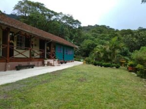 Paranapiacaba Village Retreat: Glamping in A Historic Mountain Village 1 Guest cabins on a hill near a forest.