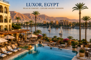 Luxor Temple – Heart Of Ancient Thebes 18 Luxury hotel and resort overlooking the Nile River in Luxor, Egypt, with a swimming pool, palm trees, traditional feluccas and ancient Egyptian temples in the distance.