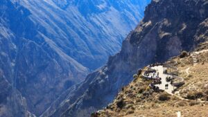 🌞⛰️⛺🛖Glamping in Cusco, Peru: Mountain Luxury Meets Inca History🥾🐒🌎✈️ 2 Tourists standing at the edge of Colca Canyon, Peru, admiring the dramatic cliffs and scenic beauty.