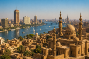 Cairo, Egypt – Museums, Bustling Markets, Ancient Mosques & Unforgettable Adventures 4 Panoramic view of Cairo neighborhoods with historic Islamic architecture, mosque domes and minarets overlooking the Nile River and modern city skyline.