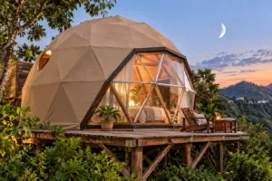 Luxury Yurt, Santa Teresa – Bohemian Comfort in Rio’s Artsy Beach District 5 luxury glamping dome in tropical Rio surroundings at sunset, overlooking lush hills and colorful Santa Teresa scenery.