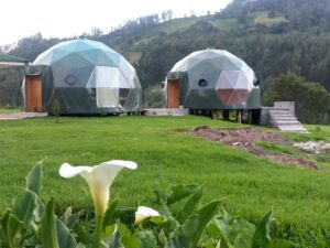 🌞⛰️⛺🛖Glamping in Cusco, Peru: Mountain Luxury Meets Inca History🥾🐒🌎✈️ 3 Two green glamping domes with large windows on platforms at Cusco glamping site