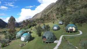 🌞⛰️⛺🛖Glamping in Cusco, Peru: Mountain Luxury Meets Inca History🥾🐒🌎✈️ 4 Seven green glamping domes on a hill platform with paths leading to each in Colca Canyon