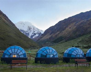 🏔️ Machu Picchu Glamping Hub 5 Blue glamping domes in the Peruvian Andes near Machu Picchu surrounded by dramatic mountain valleys and scenic Salcantay Trek landscapes.