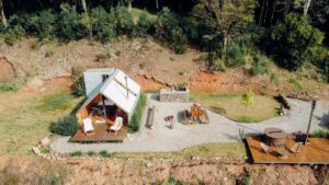 Farm house with lawn chairs 