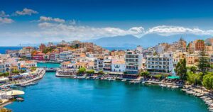 🌅 Santorini & Crete: Ultimate Greek Island Adventures For Winter 2 Panoramic view of Crete, Greece, featuring mountains, coastline, and ancient ruins — a perfect winter holiday destination.”