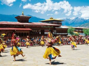 🇧🇹 Bhutan: Land of The Thunder Dragon 🏔️🌿 3 Colorful Bhutanese festival with traditional dancers, monks, and vibrant costumes in a mountain valley.