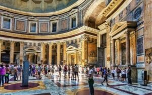 The Pantheon: Rome’s Architectural Masterpiece 2 Interior of the Pantheon in Rome, Italy, with many visitors exploring the historic space.