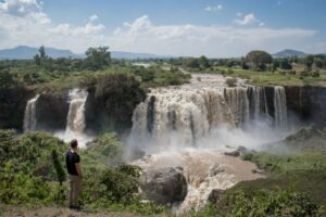 A traveler admires the powerful Blue Nile Falls near Lake Tana, one of Ethiopia’s most breathtaking natural wonders.