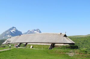 Viking Longhouses: Homes Of The NorseViking Longhouses Were The Central 1 Reconstructed Viking longhouse with wooden walls and thatched roof, showing interior living and communal spaces.