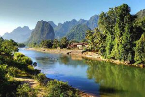 Mekong River Expeditions – Exploring Laos’ Majestic Waterway 1 Scenic view of the Mekong River winding through the lush landscapes of Laos.