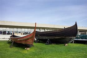 ⛵ Roskilde Viking Ship Museum, Denmark: Explore the Legacy of the Vikings 3 Two Viking ships displayed outside the Viking Ship Museum in Roskilde, Denmark.