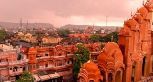 View of Jaipur city with a large temple wall and iconic pink city buildings