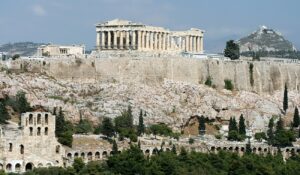 🏛️ The Acropolis Of Athens: Greece’s Iconic Landmark 2 Distant panoramic view of the Acropolis of Athens perched atop the citadel, showcasing ancient temples and cityscape, perfect for a holiday or winter adventure.