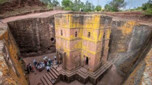 ✨ Religious & Cultural Significance 1 Aerial view of Lalibela’s clustered churches – a holy city carved into volcanic rock.