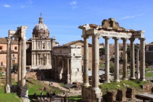 Roman Forum: The Political and Social Heart of Ancient Rome 1 Panoramic view of the Roman Forum in Rome, Italy, showcasing ancient temples, arches, and ruins.