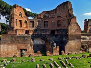 Palatine Hill: Rome’s Legendary Seat of Power 2 Visitors exploring the ruins of ancient buildings on Palatine Hill in Rome, Italy.