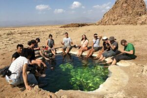 Danakil Depression – Ethiopia’s Otherworldly Landscapes 4 People Relaxing by the water’s edge in Ethiopia’s Danakil Depression.