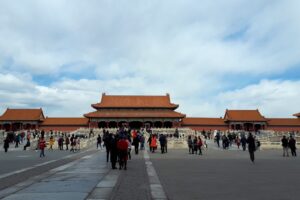 🏯 The Forbidden City, Beijing: Step Inside China’s Imperial Heart🌏 3 Dozens of visitors walking through the central courtyard of the Forbidden City in Beijing, China.