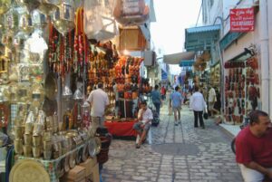 Marketplace inside Sousse Medina with colorful goods, spices, and local crafts