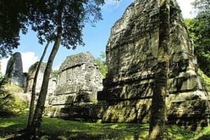 The Great Pyramid of Tikal in Guatemala, a towering Mayan structure surrounded by jungle, showcasing the grandeur of ancient Maya civilization.