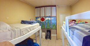 Bunk beds and closet in a cozy motel room near Iguazú Falls, Argentina