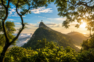 ✝️ Christ the Redeemer – Rio’s Famous Mountaintop Landmark 3 Corcovado Mountain rising above the lush rainforest in Rio de Janeiro with Christ the Redeemer visible at the summit.