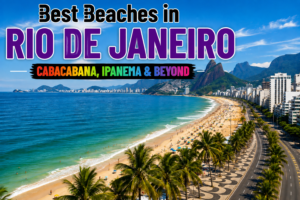 🌊 Best Beaches in Rio De Janeiro – Copacabana, Ipanema& Beyond 1 Best Beaches in Rio de Janeiro featuring a sweeping tropical coastline, turquoise Atlantic water, golden sand, palm trees, beachfront buildings, and dramatic green mountains.