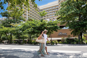 🚠 Sugarloaf Mountain & Urca – Trails, Beaches & Guanabara Bay 18 Travelers walking outside the Fairmont Rio de Janeiro Copacabana hotel during a stay in Rio de Janeiro, Brazil.