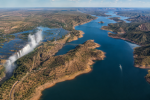 Aerial view of Zimbabwe showing the Zambezi River, Victoria Falls, dramatic gorges and expansive waterways surrounded by wilderness.