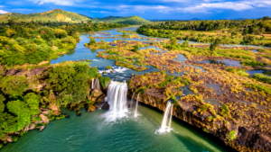 Aerial view of tropical waterfalls, rivers and lush wilderness in Africa