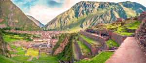 🏔️ Ollantaytambo Ruins & Sacred Valley Adventure Guide 1 Panoramic view of Ollantaytambo ruins, ancient Inca terraces, town, and Andes mountains in Peru’s Sacred Valley